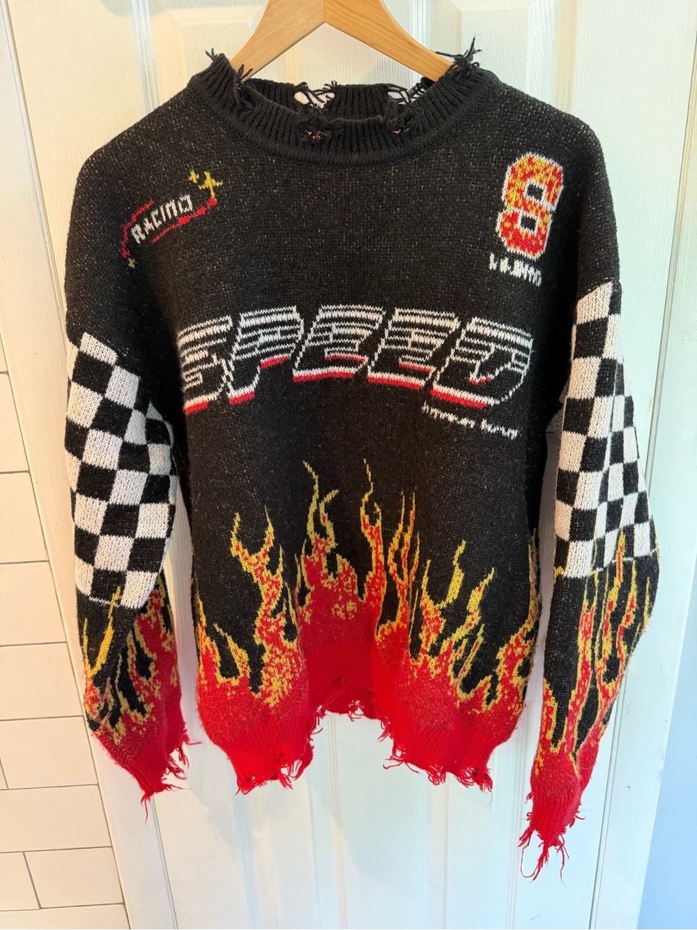 Women’s Race Themed Sweater with frayed edges and unique print, size Medium